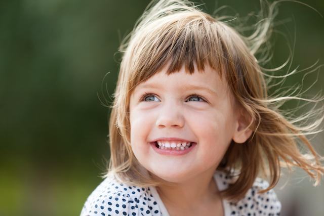 young girl smiling I laser dentistry Decatur IL