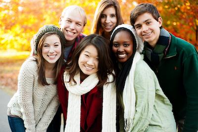 A group of people smiling after getting braces in Decatur, IL