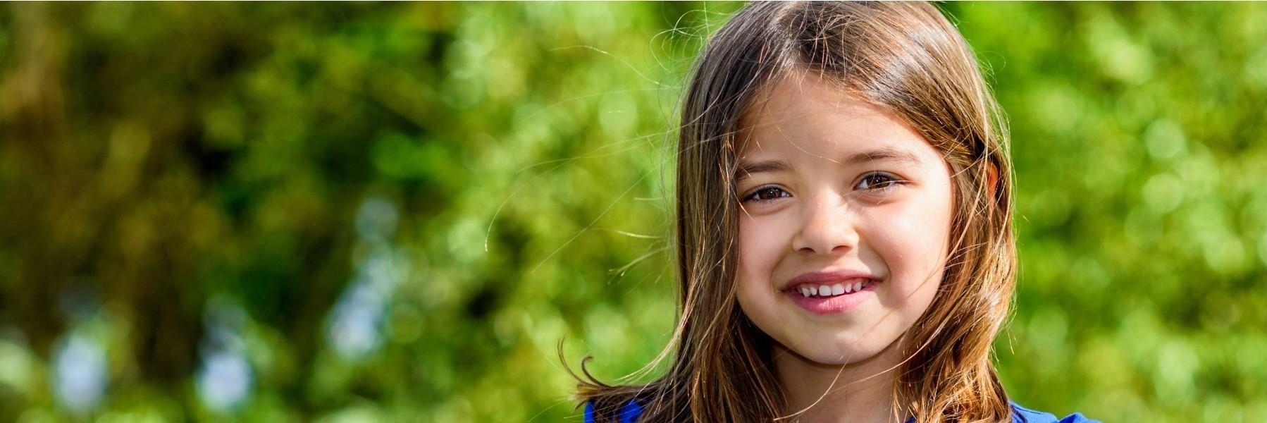 Young girl smiling after dental check up at Jerger Pediatric Dentistry