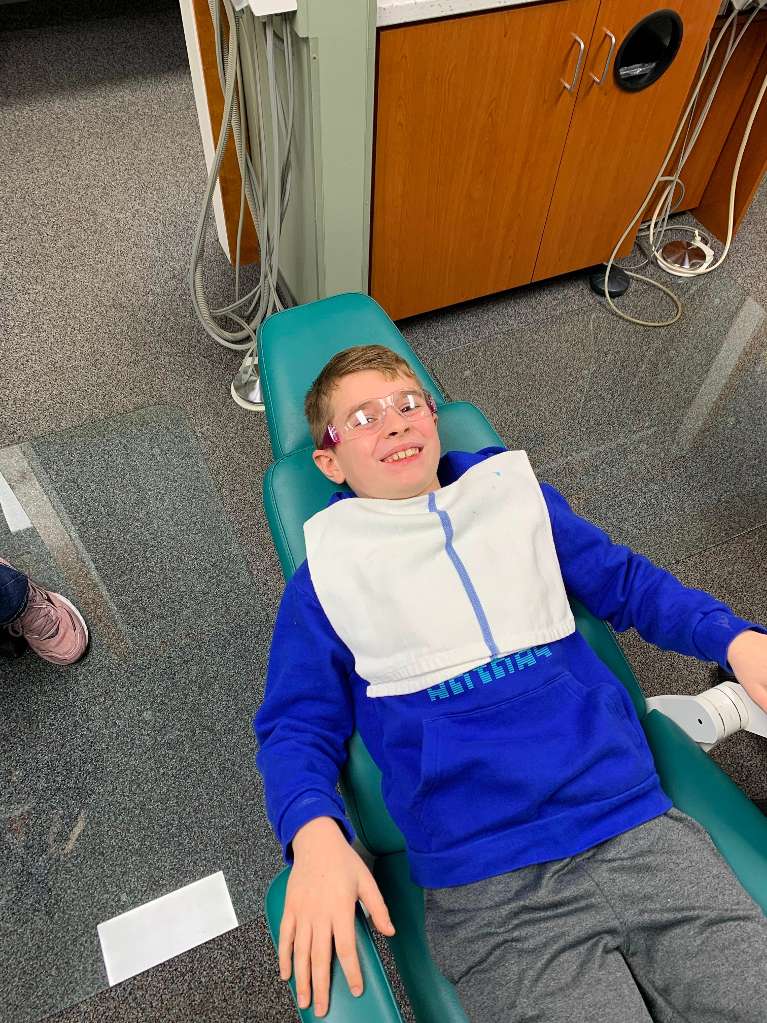 Kid relaxing on the dental chair during dental check up and examination in Decatur, IL