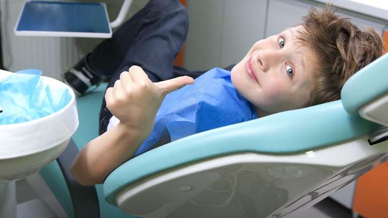 Kid relaxing during dental check up and examination in Decatur, IL