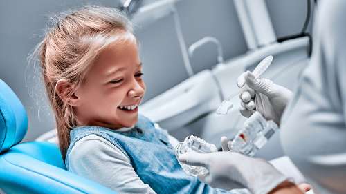 A child smiling after a Pediatric Emergency Dentist in Decatur, IL