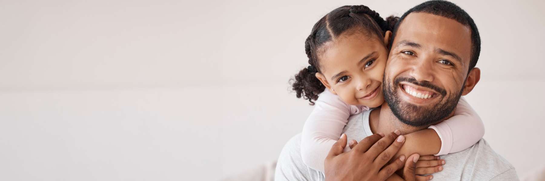 A father and daughters smiling after Pediatric Emergency Dentist in Decatur, IL